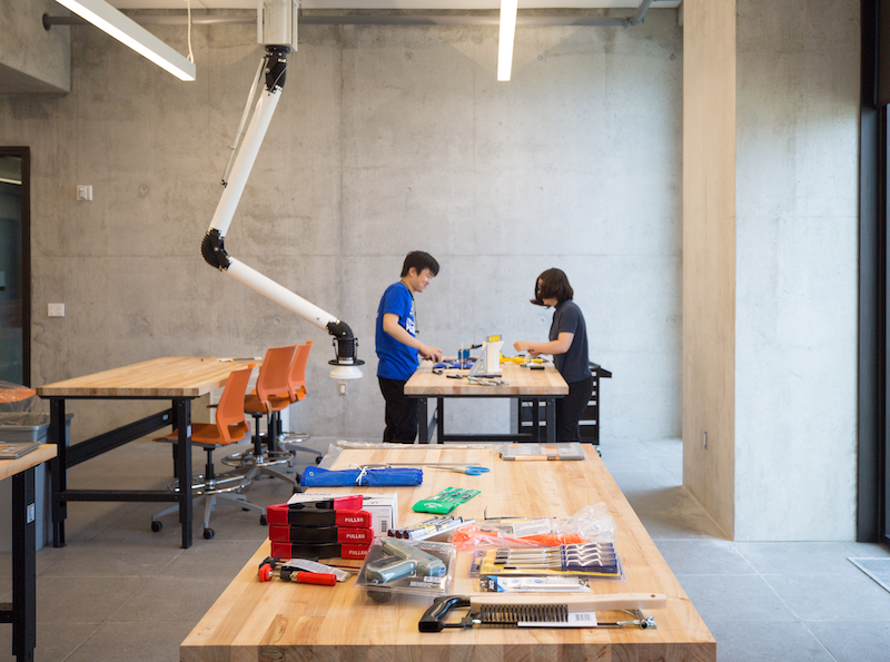two students in workspace