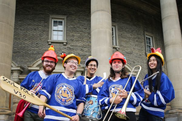 members of the skule band posing on campus